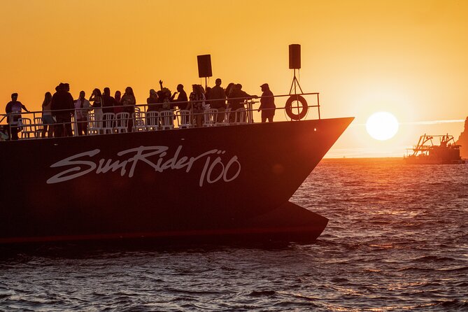 Whale Watching Dinner Cruise in Cabo San Lucas - Boarding The Catamaran With A Drink In Hand